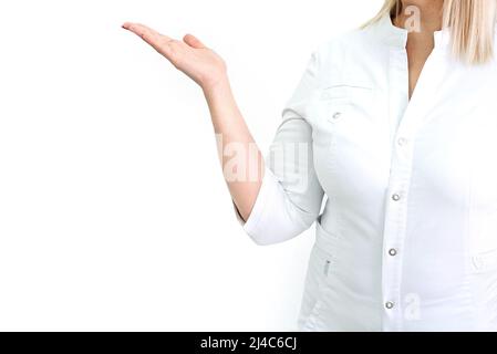 Doctor's hands showing to the side. medical uniform. Cosmetology and medicine. Copy space. Isolated. Stock Photo