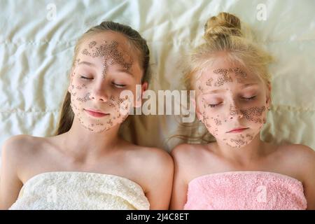 Girls with facial masks of chia seeds. Top view. Stock Photo