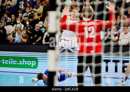 Kiel, Germany. 13th Apr, 2022. Handball: World Cup qualifying, Germany - Faroe Islands, Europe, knockout round, 3rd qualifying round, first leg, Wunderino Arena. Germany's Juri Knorr (M) throws at goal. Credit: Frank Molter/dpa/Alamy Live News Stock Photo