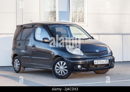 Novosibirsk, Russia - 04. 12. 2022: black hatchback Toyota Funcargo compact universal car parked outdoors on a warm summer day, front view Stock Photo