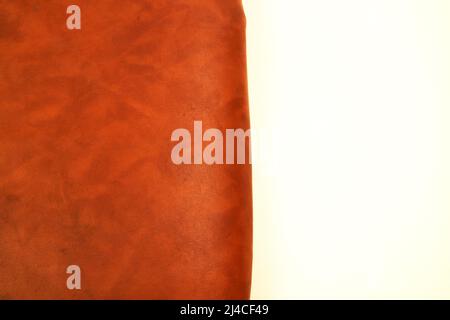 photo studio of dark orange imitation leather texture white background Stock Photo