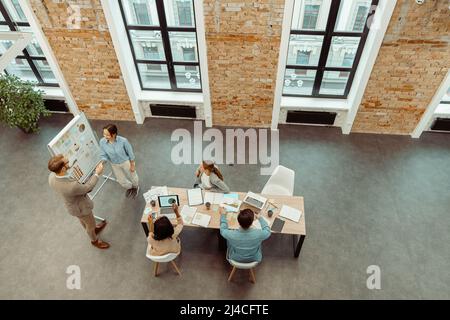 Two people shaking hands during a meeting in the office Stock Photo