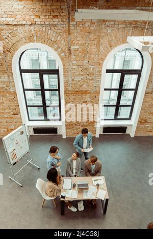 Colleagues working on a new project in the office Stock Photo