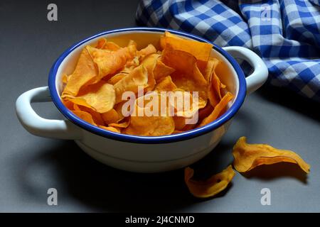 Sweet crisps in shell, sweet potato (Ipomoea batatas) Stock Photo