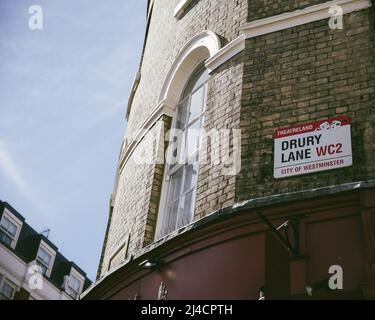 Greater London, London, UK - April 12, 2016: An East London building, against a clear blue sky, shows the Drury Lane street sign.