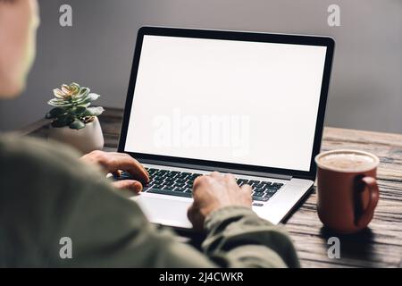 young man using a laptop. rear view . Stock Photo