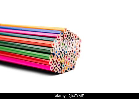 Multicolored pencils lying in a pile on a white background Stock Photo