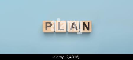 Plan word on wooden cubes. Goals, success, strategy, solution . Business concept and web banner, header for plan Stock Photo