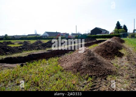 Trenches dug in field for archaeological survey next to village of Ruskington, Sleaford, Lincolnshire, England, UK Stock Photo