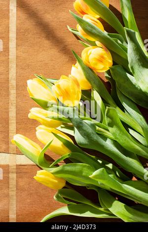 Tulips on wooden background Stock Photo
