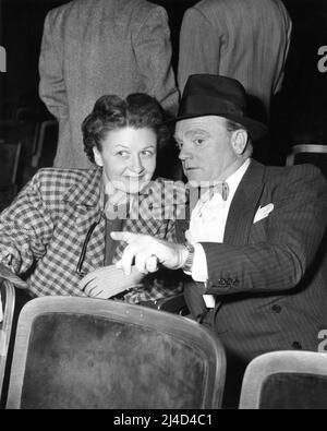 JAMES CAGNEY and his Wife BILLIE / FRANCES CAGNEY watching rehearsals for a Gala Benefit in which he appeared at the Shrine Auditorium in Los Angeles in April 1949 Stock Photo