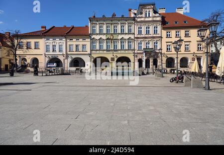 BIELSKO-BIALA, POLAND on APRIL 2022: Square in historical european city center in Silesian district, clear blue sky in warm sunny spring day. Stock Photo