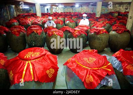 QIANDONGNAN, CHINA - APRIL 14, 2022 - Workers work in a wine cellar in Qiandongnan, Guizhou Province, China, April 14, 2022. Stock Photo