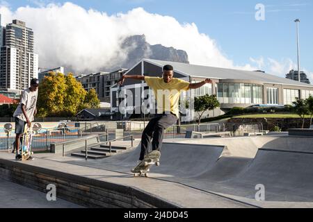Cape Town, South Africa. 13th Apr, 2022. People skateboard in a park at V&A Waterfront in Cape Town, South Africa, April 13, 2022. African tourism experts on Wednesday said the continent expects the rest of the world to help bring its tourism industry back to financial fitness in a sustainable way. Credit: Lyu Tianran/Xinhua/Alamy Live News Stock Photo