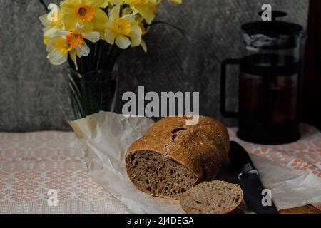 Top view of assortment of different kind of cereal bakery: bread, pasties, buns, pretzel and croissant on old wooden background. Stock Photo