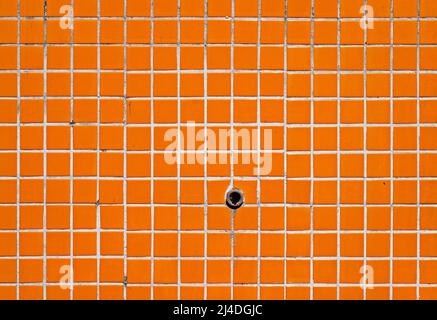 Old orange tile wall texture background Stock Photo