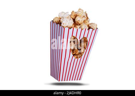 Love popcorn concept with one popcorn box with love heart coutout on a white background and shadow Stock Photo