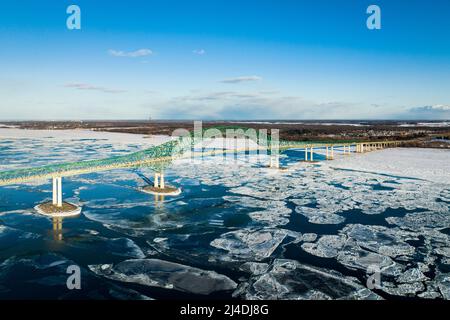 Laviolette Bridge, during winter, crossing the St. Lawrence River and ice floe in Trois-Rivieres, Quebec, Canada Stock Photo