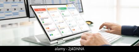 Kanban Project Management Software On Laptop. Digital Calendar Schedule Stock Photo