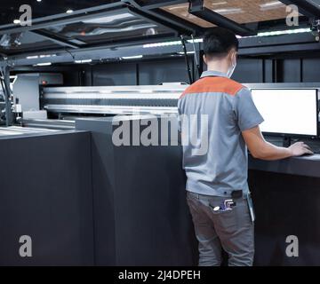 professional printer operating modern industrial printing machine Stock ...
