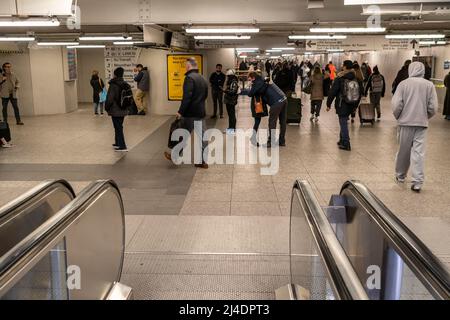 Commuters crowd the LIRR level in the under renovation Pennsylvania Station in New York on Wednesday, March 30, 2022.    (© Richard B. Levine) Stock Photo