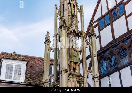 The Buttercross, a historic holy cross monument and landmark, High Street, town centre of Winchester with statue of King Alfred, Hampshire, England Stock Photo