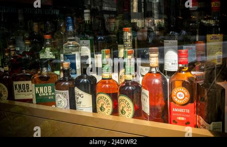 A collection of liquor on display in the window of a restaurant in New York on Monday, April 11, 2022.  (© Richard B. Levine) Stock Photo