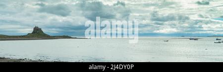 View from the harbour on Holy Island to Lindisfarne Castle Stock Photo