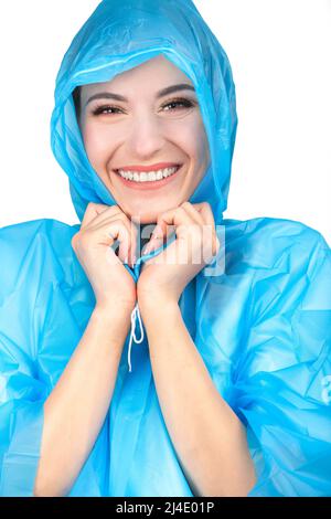 Beautiful woman with makeup close-up studio portrait. Model wearing blue plastic raincoat and hiding under hood and hold it with her hands. Model with Stock Photo