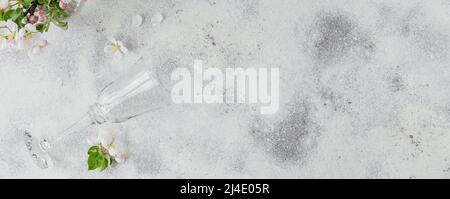 Place table setting with blossoming apple tree branches and flowers Stock Photo