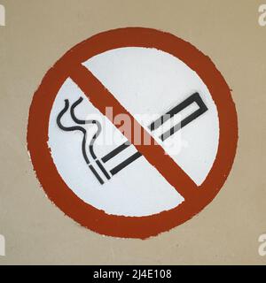 no smoking symbol spray and hand painted through stencil on a wall Stock Photo