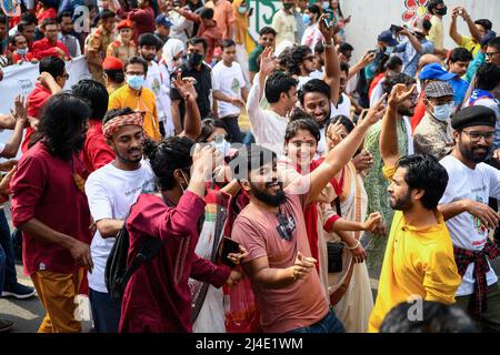 Dhaka, Bangladesh. 14th Apr, 2022. People march along the street to celebrate the first day of the Bengali New Year. Bangladeshi people participate in a colorful parade to celebrate the first day of the Bengali New Year or Pohela Boishakh on April 14. Thousands of Bangladeshi people celebrate it with different colorful rallies, cultural programs with traditional dance and music, this Bengali year was introduced during the regime of Emperor Akbar to facilitate revenue collection in the 16th century. (Photo by Piyas Biswas/SOPA Images/Sipa USA) Credit: Sipa USA/Alamy Live News Stock Photo