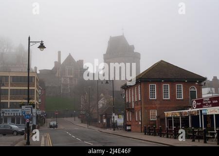 Windsor, Berkshire, UK. 14th April, 2022. The Curfew Tower at Windsor Castle surrounded by mist this morning. The Easter Bank Holiday weekend is expected to be warm and sunny. Credit: Maureen McLean/Alamy Live News Stock Photo