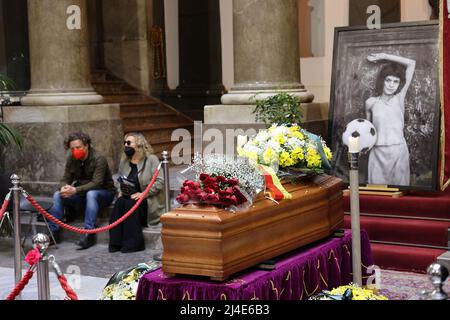 Palermo, Italy. 14th Apr, 2022. in the photo the funeral parlor of the photographer Letizia Battaglia set up at Palazzo delle Aquile seat of the municipality of Palermo, the photo above the coffin made known, a little girl playing with a ball herself photographed her in front of a door. Credit: Independent Photo Agency/Alamy Live News Stock Photo