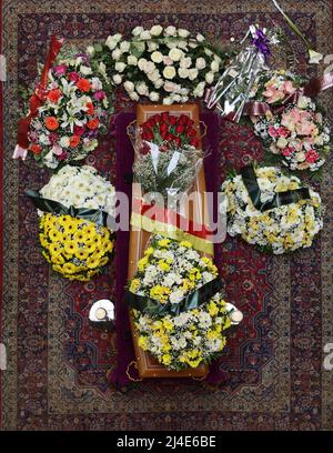 Palermo, Italy. 14th Apr, 2022. in the photo the funeral parlor of the photographer Letizia Battaglia set up at Palazzo delle Aquile seat of the municipality of Palermo, the photo above the coffin made known, a little girl playing with a ball herself photographed her in front of a door. Credit: Independent Photo Agency/Alamy Live News Stock Photo