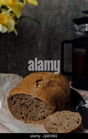 Sliced bread isolated on a white background. Bread slices and crumbs viewed from above. Top view. Stock Photo