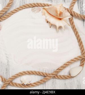 Sea background with ropes and seashells Stock Photo