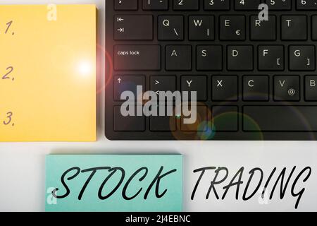 Text sign showing Stock Trading. Internet Concept Buy and Sell of Securities Electronically on the Exchange Floor Computer Keyboard And Symbol Stock Photo