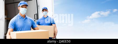 Blue Delivery Men Unloading Package From Truck With Face Mask Stock Photo
