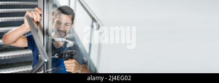 Portrait Young Male Carpenter Repairing Door Lock Stock Photo