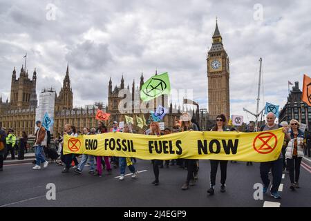 London, UK, 13th April 2022. Protesters on Westminster Bridge. Extinction Rebellion protesters marched through central London, demanding that the government acts on the ecological and climate crisis. Stock Photo