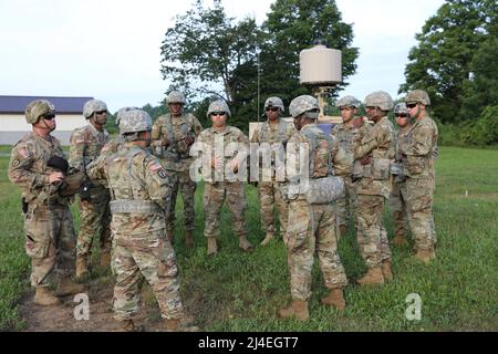 Counter Mortar Radar  - New York Army National Guard Soldiers with the 27th Infantry Brigade Combat Team review an upcoming training mission while fielding the new AN/TPQ-50 Lightweight Counter Mortar Radar (LCMR) on July 31, 2019, at Fort Drum, New York. The radar section for the 27th Infantry Brigade Combat Team took a course on the new radar system that was over a week long before testing in the field. ( U.S. Army National Guard photo by Sgt. Andrew Winchell ) Stock Photo