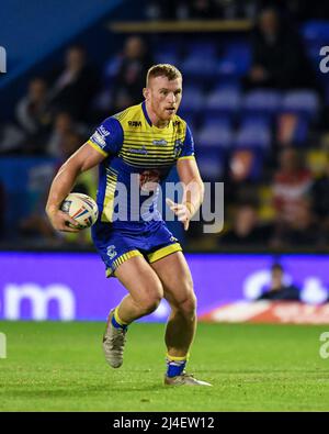 Jack Hughes #13 of Warrington Wolves in action during the game Stock Photo