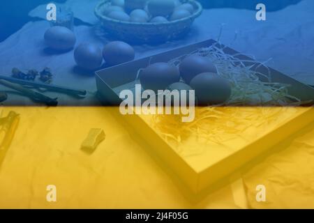 Tools for decorating Paschal eggs, Pysankas. Workplace. Rustic background. Collection of eggs. Homemade pen for drawing eggs. Preparation for holiday. Stock Photo
