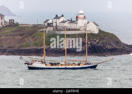 Crosshaven, Cork, Ireland. 14th April, 2022. Swedish triple masted schooner Alva passes the Roches Point lighthouse as she departs after a short visit to Cork, Ireland. . - Credit; David Creedon / Alamy Live News Stock Photo