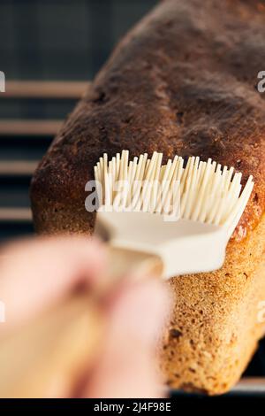 The process of making rye molded bread. Coating the finished bread with ...