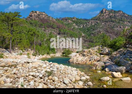 Solenzara River with its wonderful natural pools in the crystal clear water in the southeast of the island of Corsica, France. Stock Photo