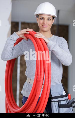 female engineer checking pipes in a construction site Stock Photo