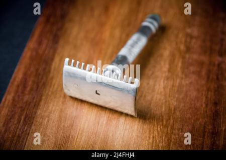 Old classic vintage shaver razor on a wooden background Stock Photo