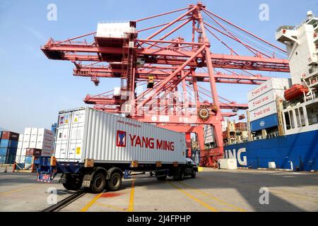 LIANYUNGANG, CHINA - APRIL 15, 2022 - An ocean-going freighter loads containers at the Lianyungang Container Terminal in Lianyungang city, East China' Stock Photo